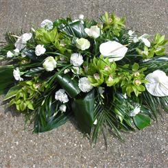 White double ended spray with luscious greenery 