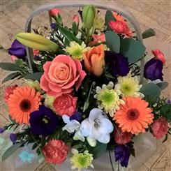 Orange and purple basket arrangment