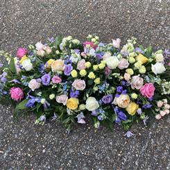 Soft pastel casket spray