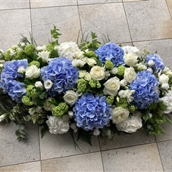 Powder blue hydrangea casket spray 